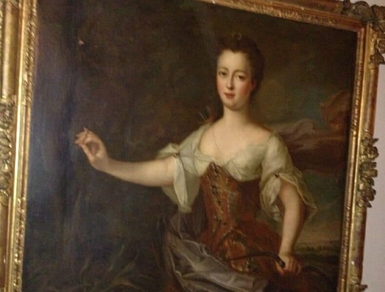 A portrait of a woman in historical attire, set against a dark background.